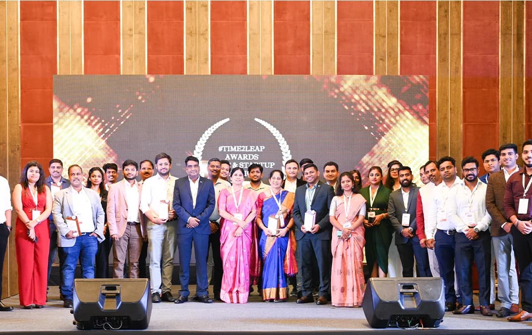 A group of awardees on stage at the Excellence Awards.