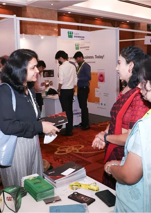 Delegates browsing an exhibitor's stall.